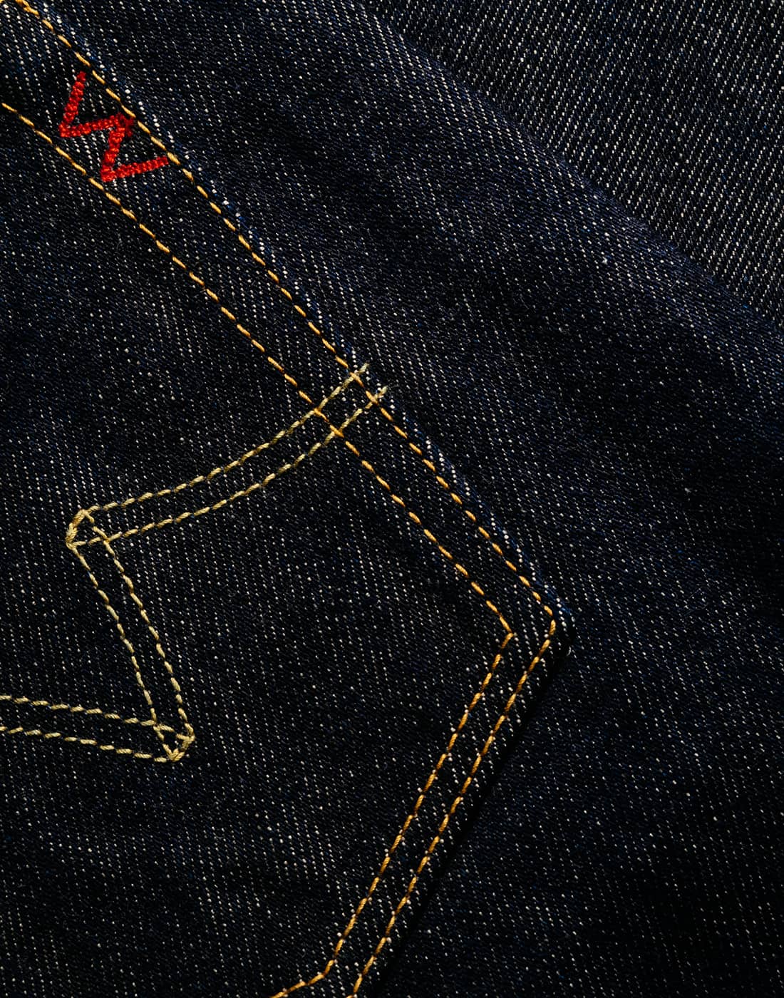 Closeup of the Iron Heart brand icon sewn on a back pocket