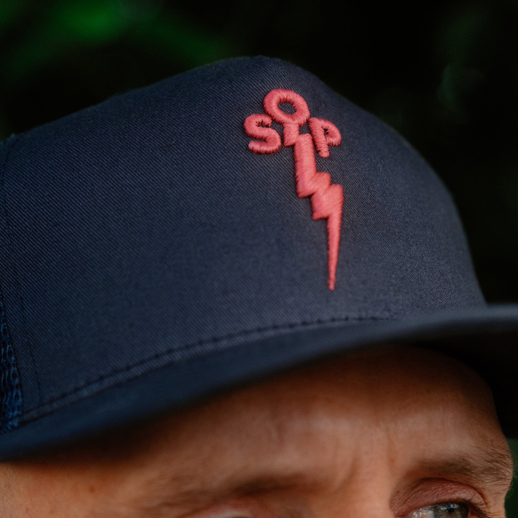 Snake Oil Provisions Embroidered Lightning Bolt Trucker Hat Navy/ Magenta