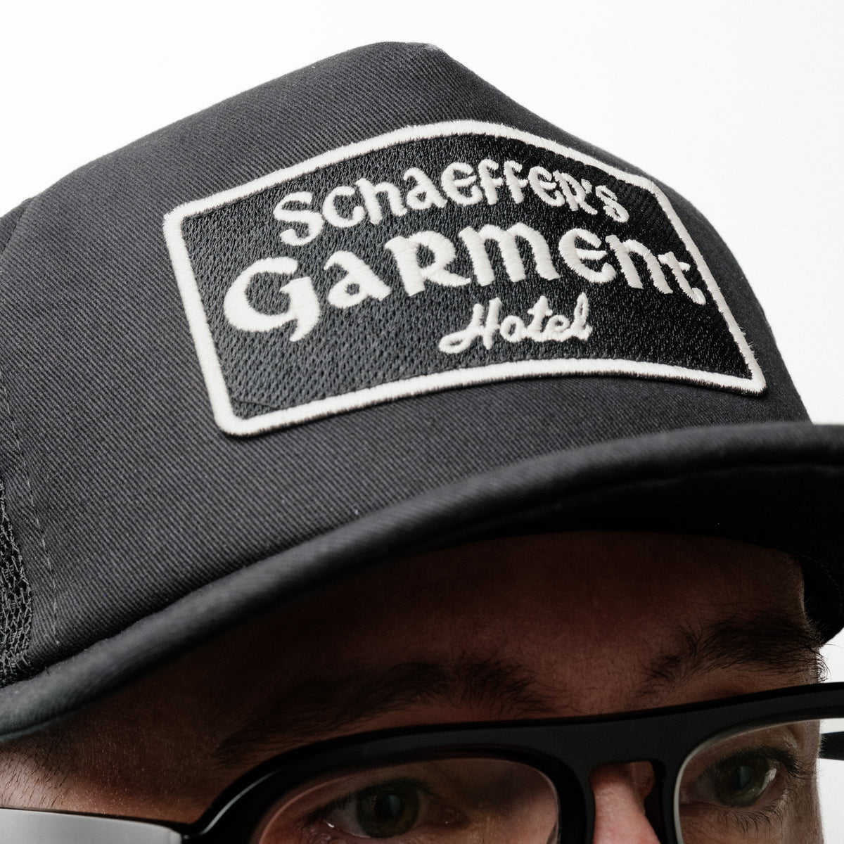Schaeffer's Garment Hotel Chateau Trucker Hat Black