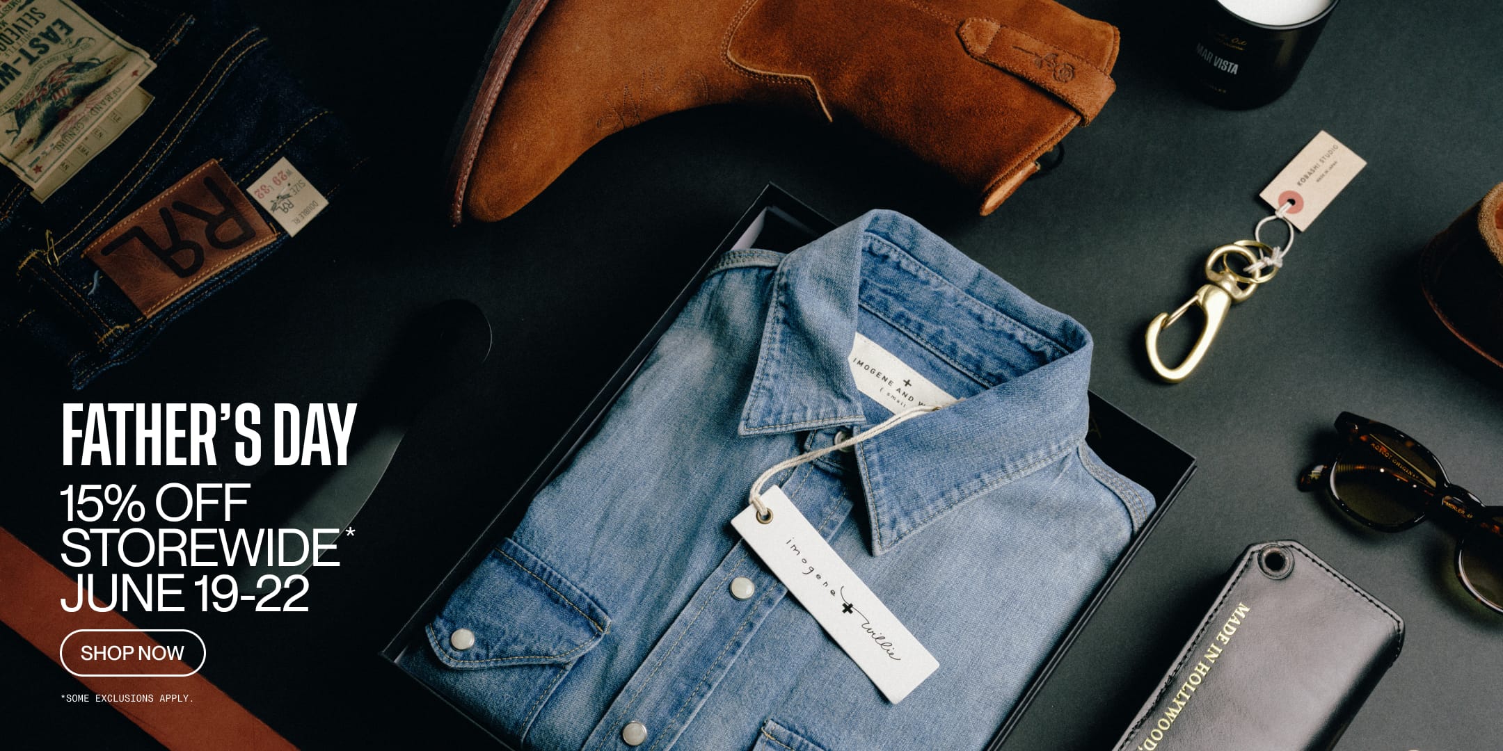 Promotional Father's Day sale banner advertising 15% Off Storewide* with jeans, wallet, wallet, and sunglasses on a dark surface.