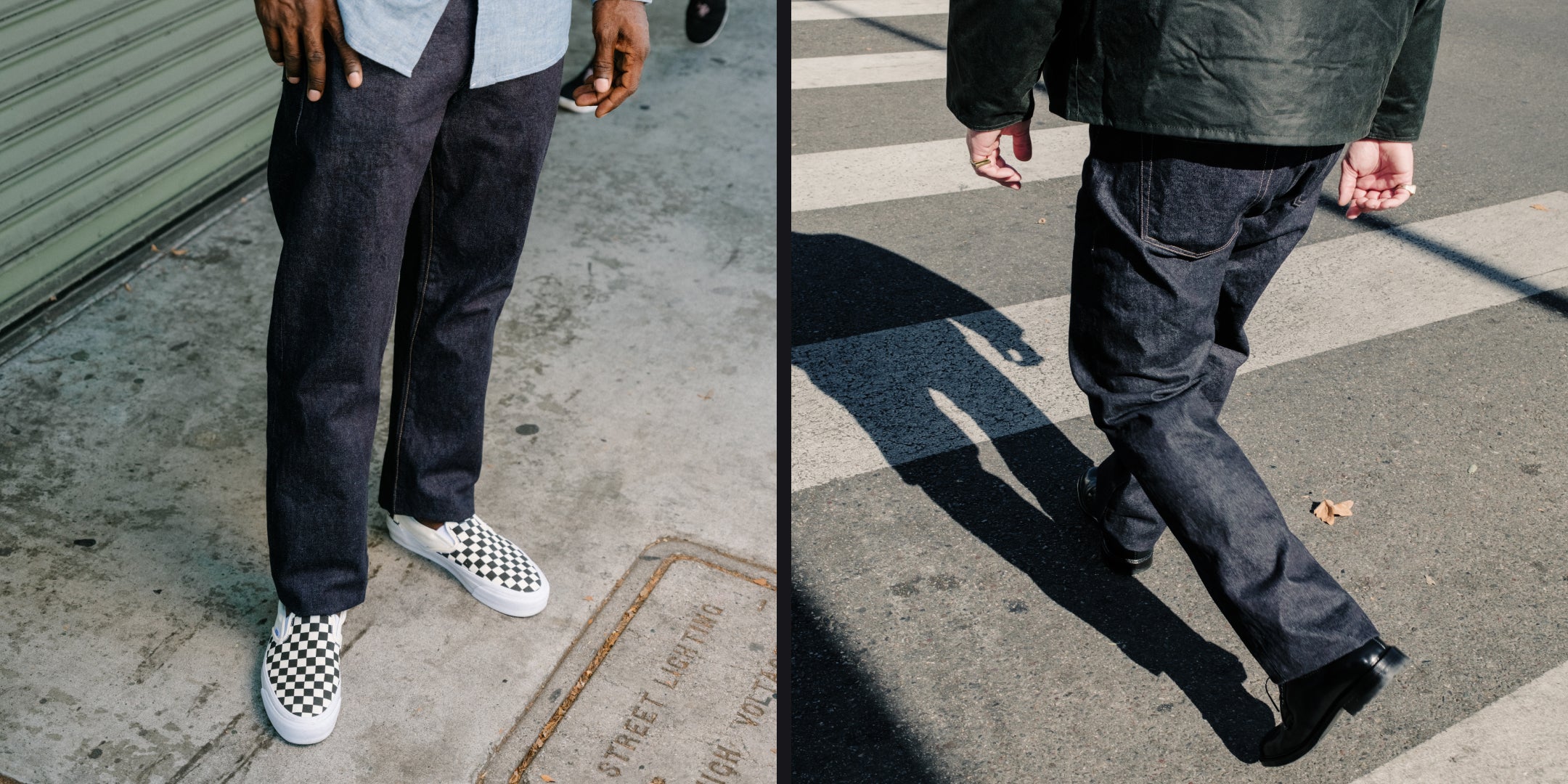 Two people wearing dark pants and shoes on a street.