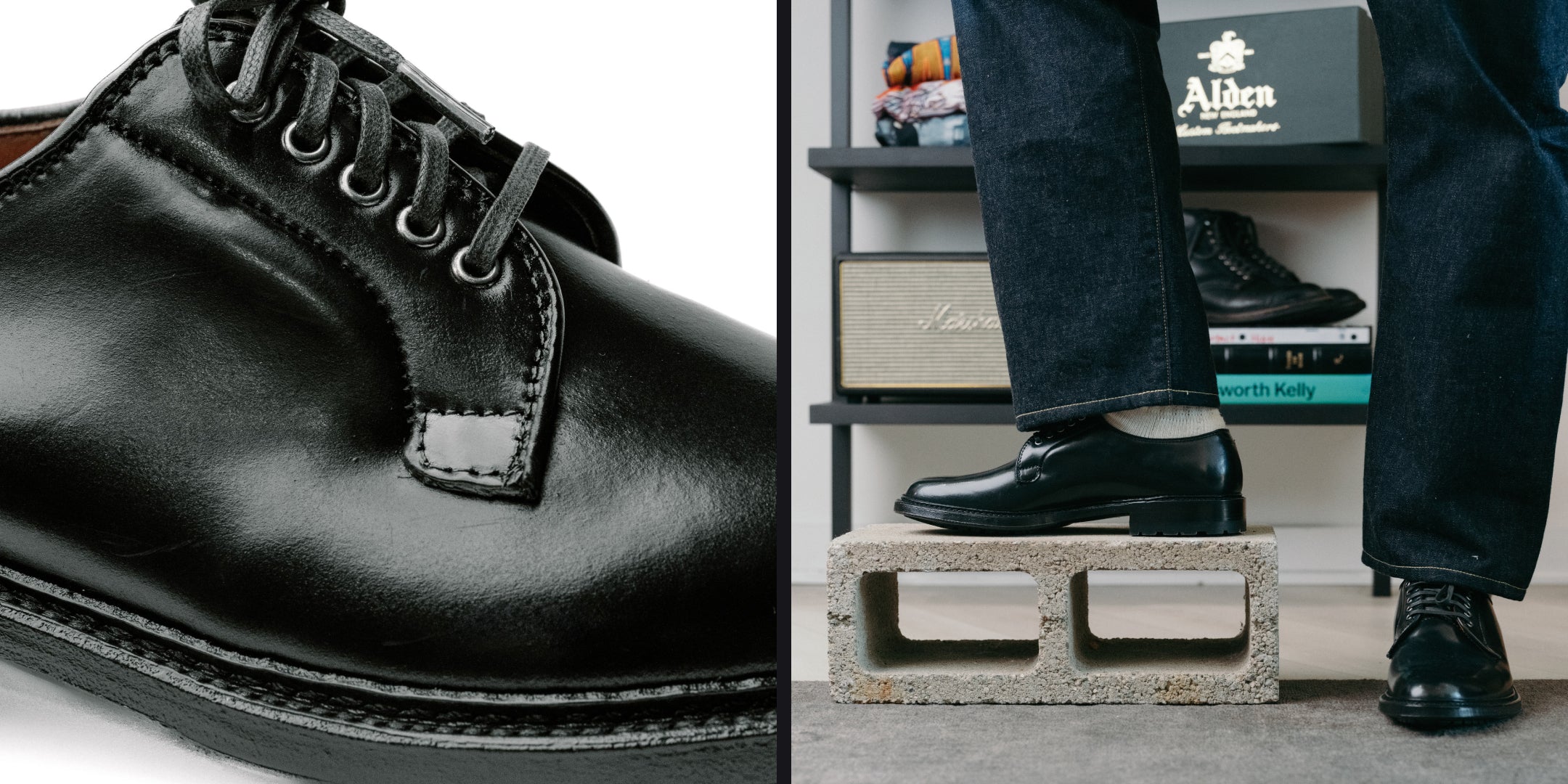 Close-up of a black leather shoe and a person wearing it standing on a concrete block.
