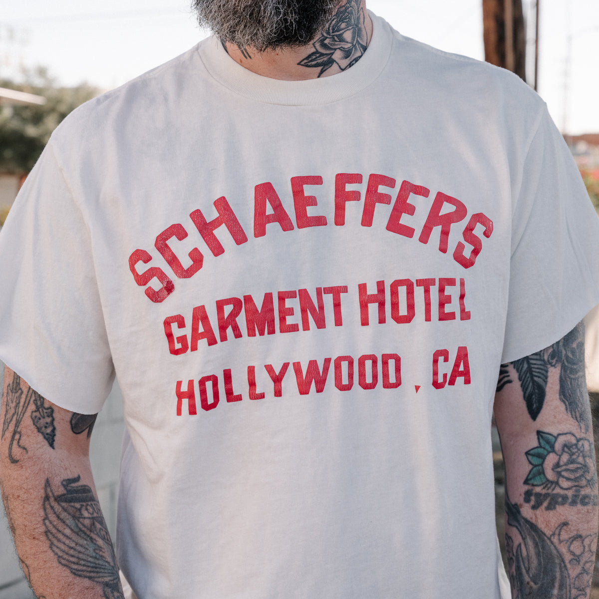 Schaeffer's Garment Hotel Cycle Varsity Drop Shoulder Raw Edge Tee White