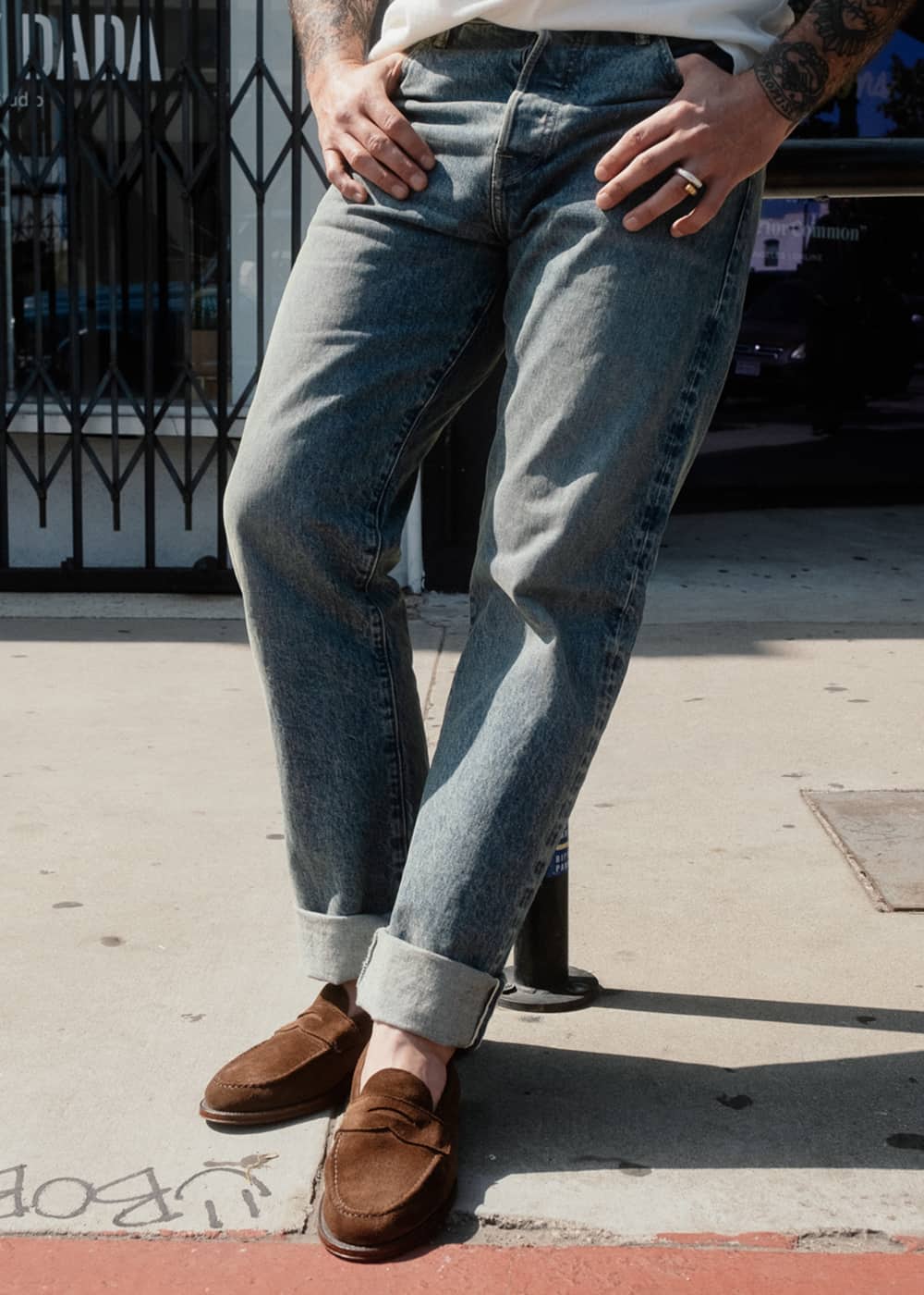 Man wearing Rogue Territory Strider Jeans in washed light indigo