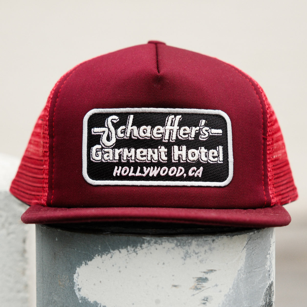 Schaeffer's Garment Hotel Trucker Hat Maroon